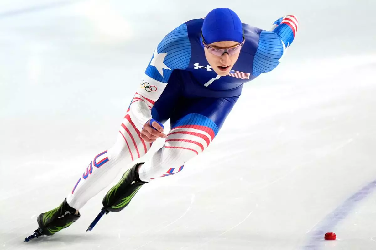 Gold medallist Jordan Stolz of the U.S. competes in the men's 500 meters speedskating race at the 2026 Winter Olympics, in Milan, Italy, Saturday, Feb. 14, 2026. (AP Photo/Luca Bruno)