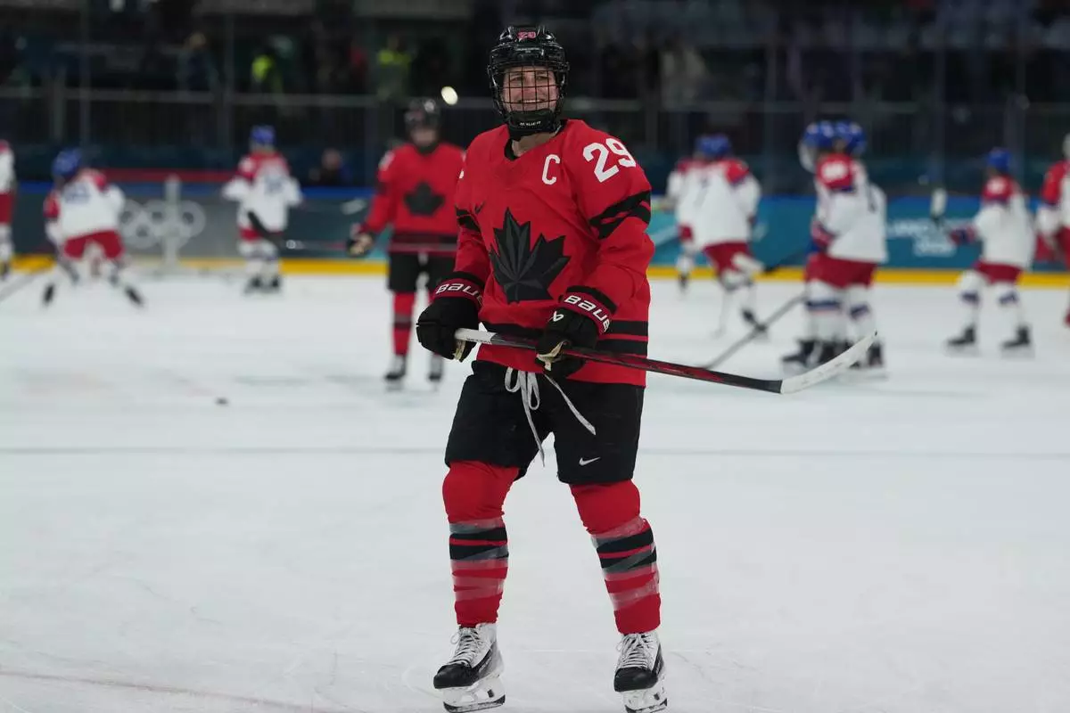 Canada's Marie-Philip Poulin (29) skates during warmups before a preliminary round match of women's ice hockey against Czechia at the 2026 Winter Olympics, in Milan, Italy, Monday, Feb. 9, 2026. (AP Photo/Carolyn Kaster)