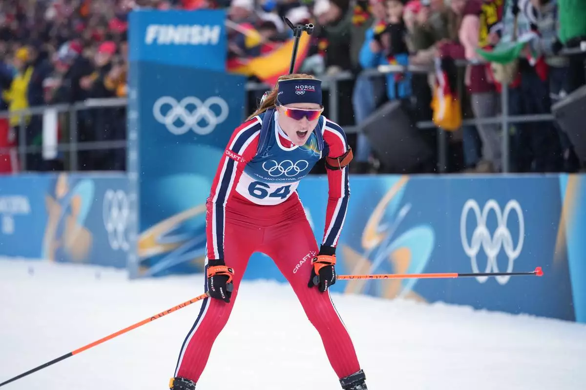 Maren Kirkeeide, of Norway, reacts after the women's 7.5-kilometer sprint biathlon race at the 2026 Winter Olympics in Anterselva, Italy, Saturday, Feb. 14, 2026. (AP Photo/Andrew Medichini)