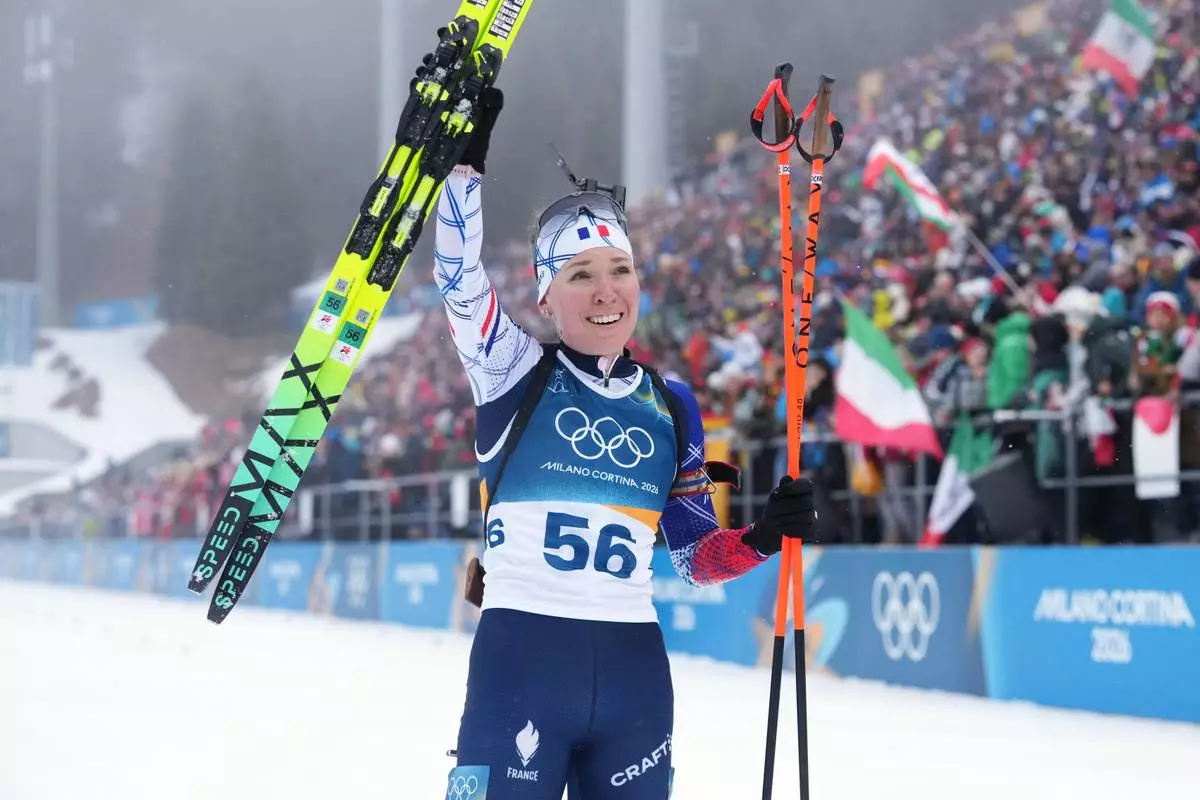 Oceane Michelon, of France, reacts in the finish area during the women's 7.5-kilometer sprint biathlon race at the 2026 Winter Olympics in Anterselva, Italy, Saturday, Feb. 14, 2026. (AP Photo/Andrew Medichini)
