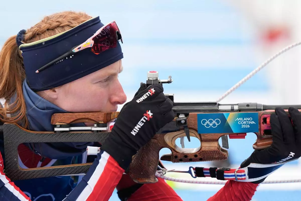 Maren Kirkeeide, of Norway, prepares to shot ahead of the women's 7.5-kilometer sprint biathlon race at the 2026 Winter Olympics in Anterselva, Italy, Saturday, Feb. 14, 2026. (AP Photo/Andrew Medichini)