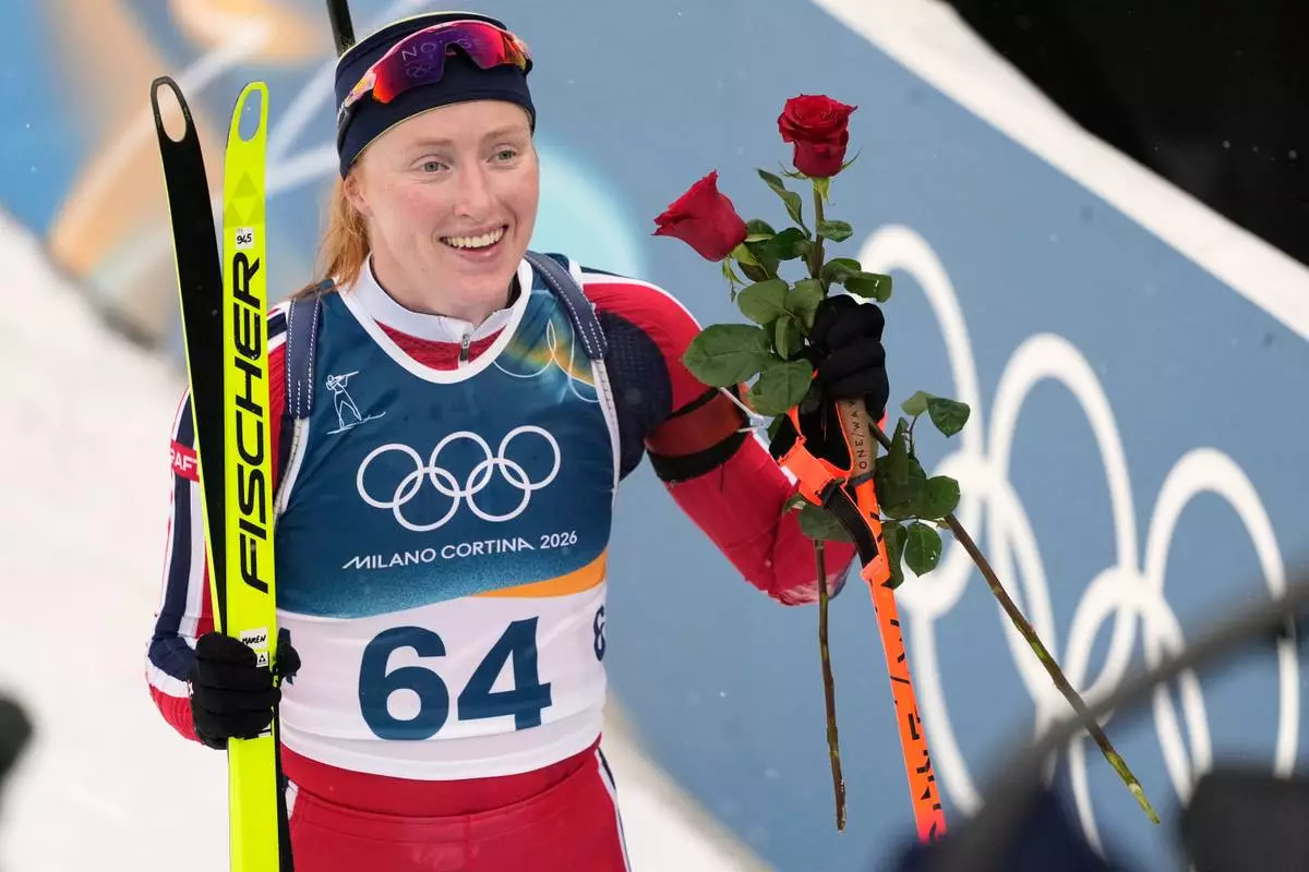 Maren Kirkeeide, of Norway, reacts after the women's 7.5-kilometer sprint biathlon race at the 2026 Winter Olympics in Anterselva, Italy, Saturday, Feb. 14, 2026. (AP Photo/Mosa'ab Elshamy)