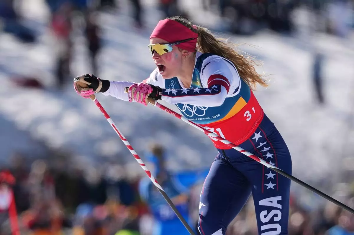 Jessie Diggins, of the United States, competes in the cross-country skiing women's team sprint free at the 2026 Winter Olympics, in Tesero, Italy, Wednesday, Feb. 18, 2026. (AP Photo/Kirsty Wigglesworth)