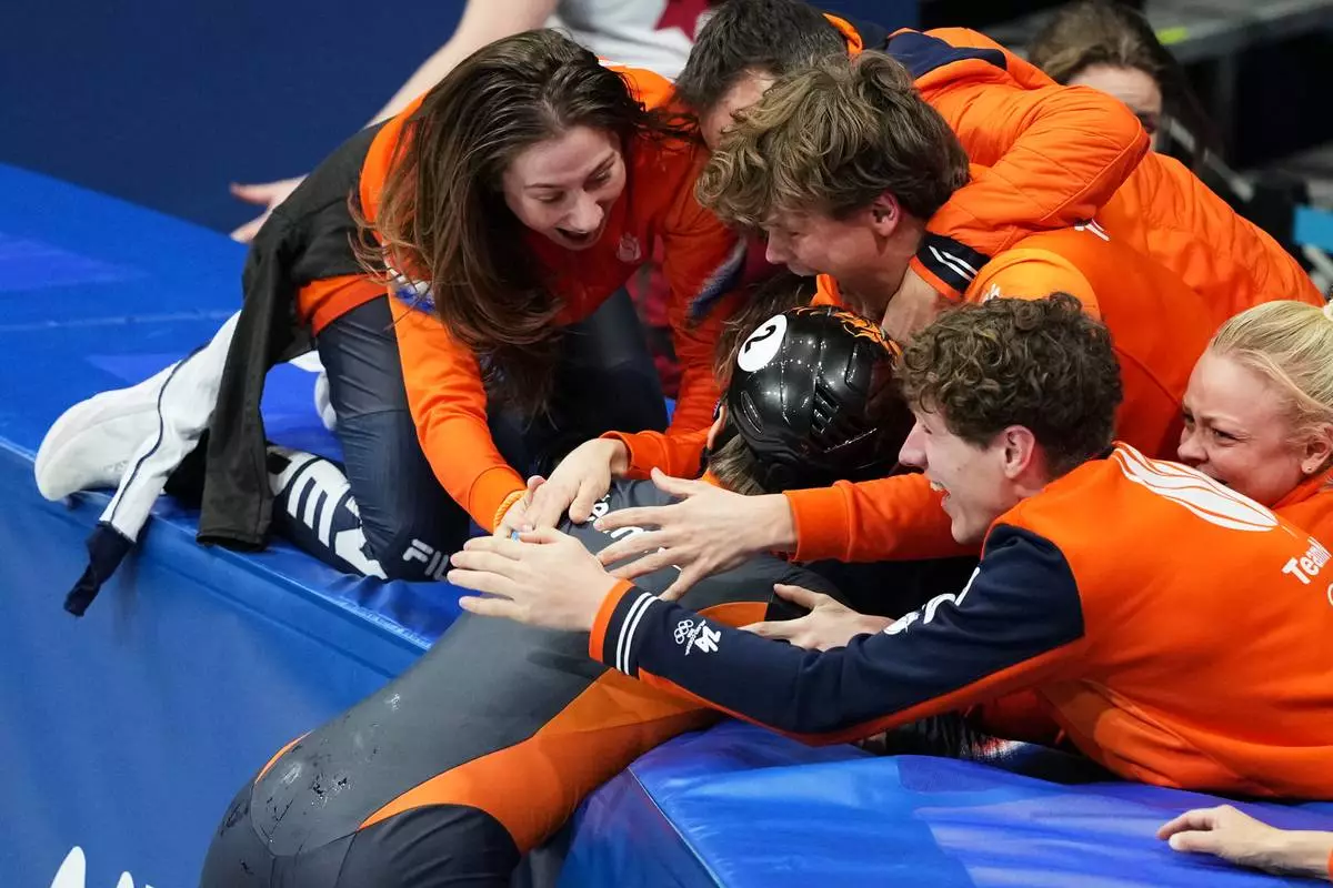 Gold medalist Jens van 't Wout of the Netherlands celebrates after the short track speed skating men's 1500m final at the 2026 Winter Olympics, in Milan, Italy, Saturday, Feb. 14, 2026. (AP Photo/Francisco Seco)