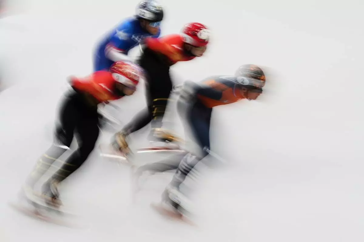 Jens van 't Wout of the Netherlands leads in the quarterfinals during the men's 1500 meter short track speed skating at the 2026 Winter Olympics, in Milan, Italy, Saturday, Feb. 14, 2026. (AP Photo/Francisco Seco)