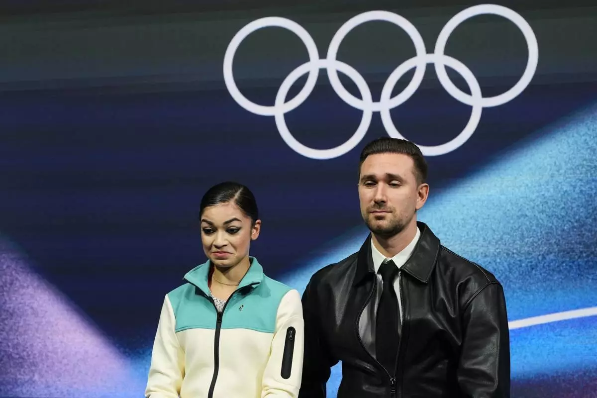 Adeliia Petrosian of Individual Neutral Athletes reacts to her score after competing in the women's short program in figure skating at the 2026 Winter Olympics, in Milan, Italy, Tuesday, Feb. 17, 2026. (AP Photo/Natacha Pisarenko)