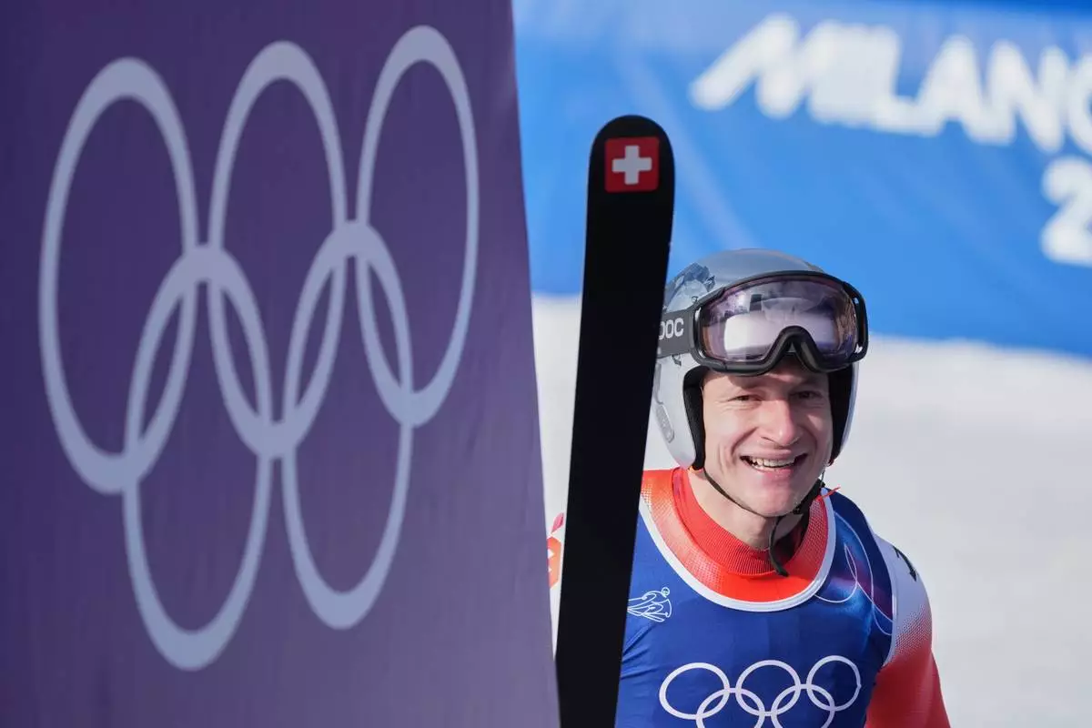 Switzerland's Marco Odermatt reacts at the finish area of an alpine ski men's downhill race, at the 2026 Winter Olympics, in Bormio, Italy, Saturday, Feb. 7, 2026. (AP Photo/Rebecca Blackwell)