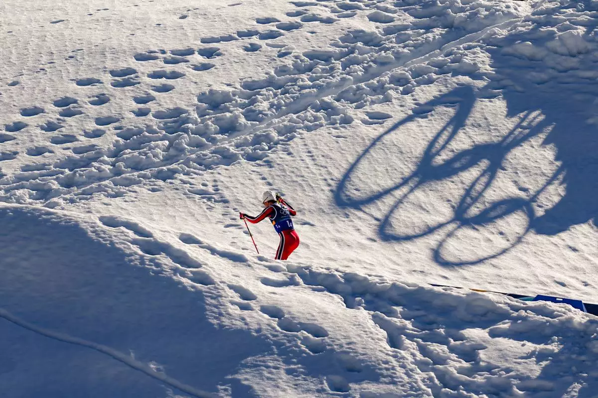 Johannes Hoesflot Klaebo, of Norway, skis uphill during the cross country skiing men's 4 x 7.5km relay at the 2026 Winter Olympics, in Tesero, Italy, Sunday, Feb. 15, 2026. (AP Photo/Matthias Schrader)