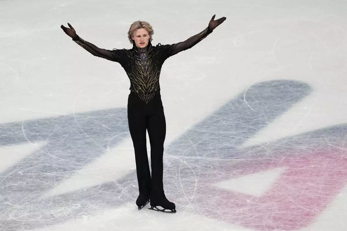 Ilia Malinin of the United States reacts at the end of his program after competing during the men's free skate program in figure skating at the 2026 Winter Olympics, in Milan, Italy, Friday, Feb. 13, 2026. (AP Photo/Francisco Seco)
