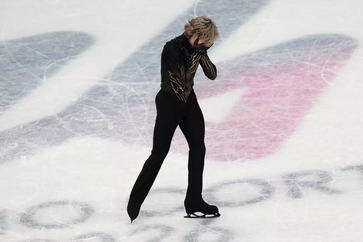 Ilia Malinin of the United States reacts at the end of his program after competing during the men's free skate program in figure skating at the 2026 Winter Olympics, in Milan, Italy, Friday, Feb. 13, 2026. (AP Photo/Francisco Seco)