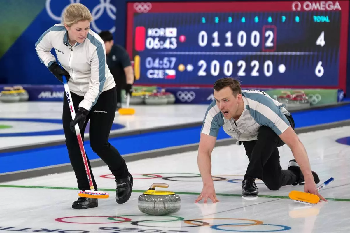 Norway's Magnus Nedregotten and Kristin Skaslien in action during the mixed doubles round robin phase of the curling competition against Estonia, at the 2026 Winter Olympics, in Cortina d'Ampezzo, Italy, Saturday, Feb. 7, 2026. (AP Photo/Misper Apawu)
