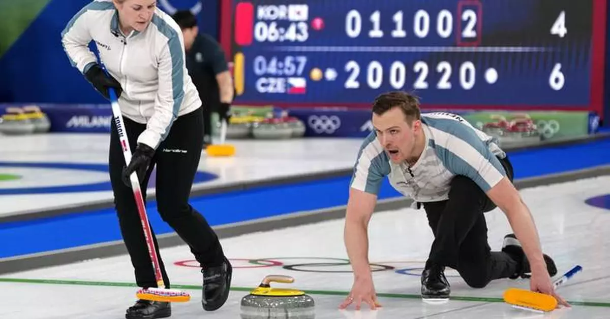 On the ice, these curlers are scowling at each other. Off the ice, they're happily married