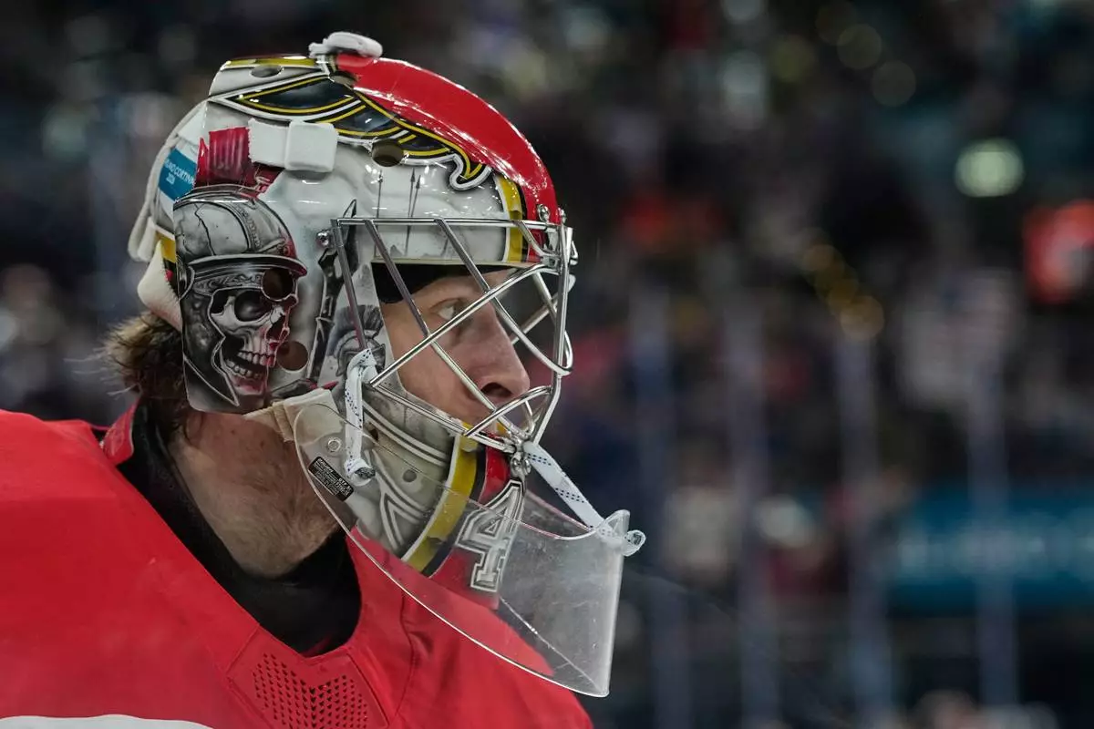 Denmark's goalkeeper Mads Sogaard looks on during a preliminary round match of men's ice hockey between United States and Denmark at the 2026 Winter Olympics, in Milan, Italy, Saturday, Feb. 14, 2026. (AP Photo/Petr David Josek)