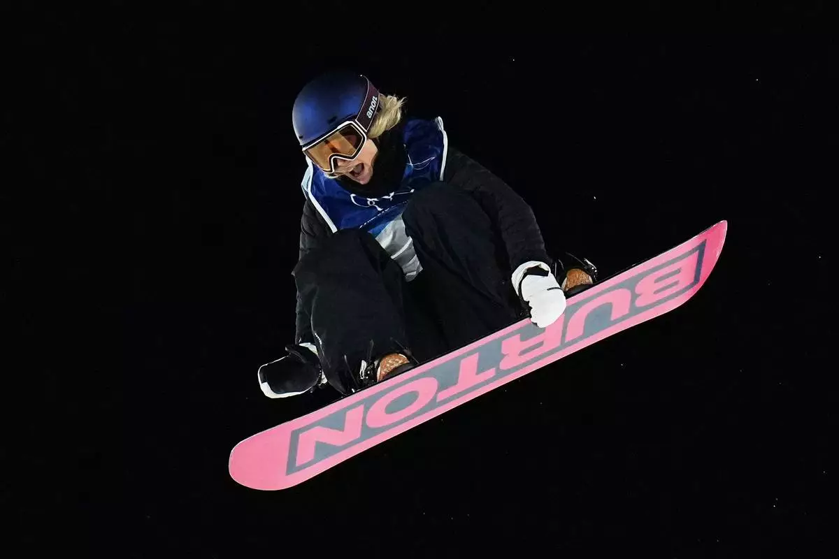 Austria's Anna Gasser competes during the women's snowboard big air qualifications at the 2026 Winter Olympics, in Livigno, Italy, Sunday, Feb. 8, 2026. (AP Photo/Gregory Bull)