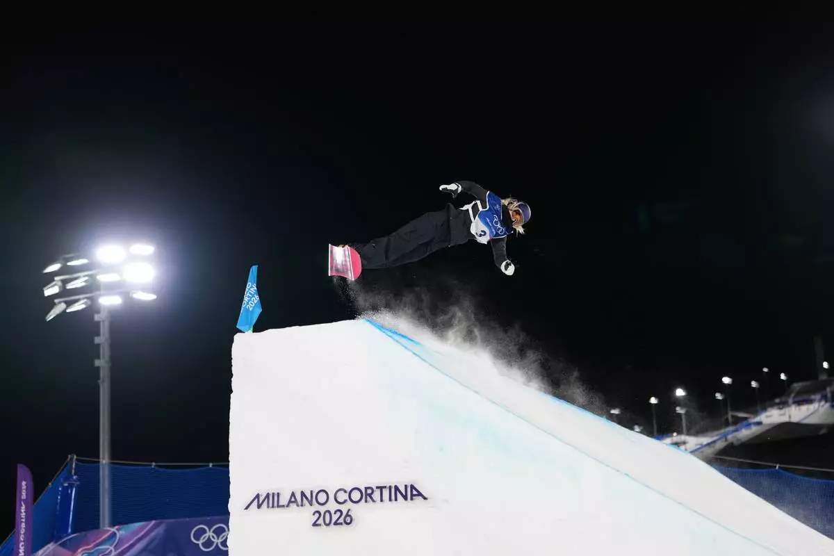 Austria's Anna Gasser competes during the women's snowboard big air qualifications at the 2026 Winter Olympics, in Livigno, Italy, Sunday, Feb. 8, 2026. (AP Photo/Abbie Parr)