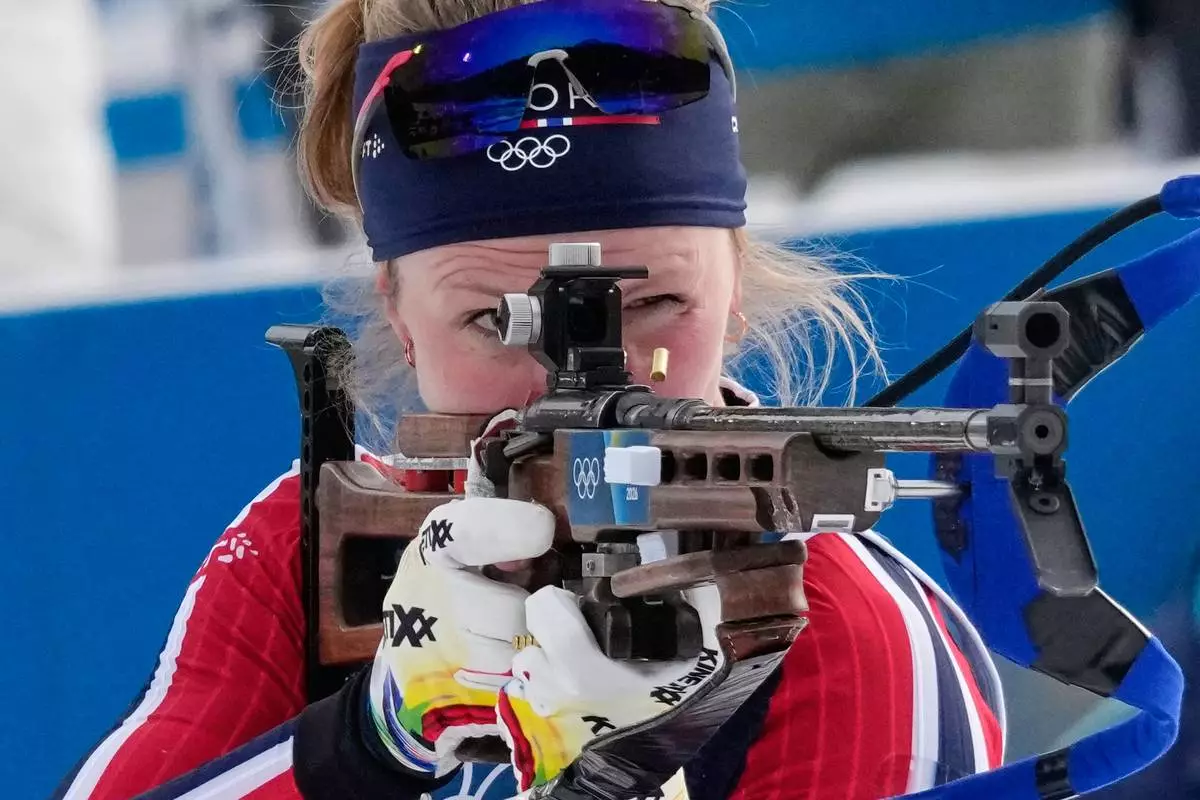 Norway's Karoline Offigstad Knotten shoots during the women's biathlon 4 x 6-kilometers relay race at the 2026 Winter Olympics, in Anterselva, Italy, Wednesday, Feb. 18, 2026. (AP Photo/David J. Phillip)