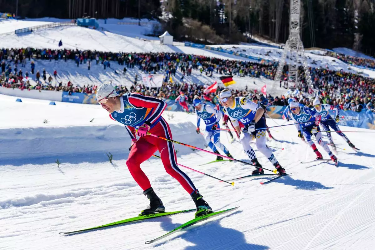 Johannes Hoesflot Klaebo, of Norway, competes in the cross-country skiing men's team sprint free at the 2026 Winter Olympics, in Tesero, Italy, Wednesday, Feb. 18, 2026. (AP Photo/Evgeniy Maloletka)