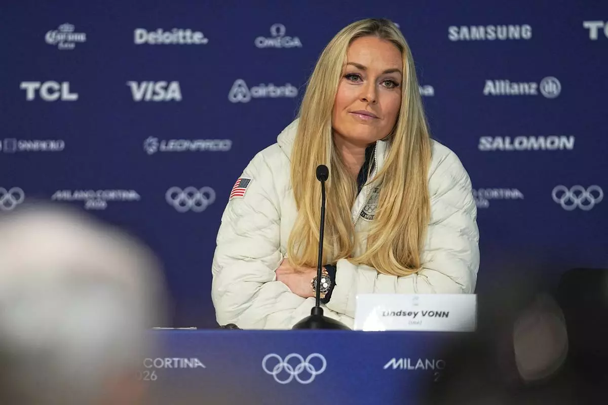 United States' Lindsey Vonn attends a press conference by the U.S. ski team at the 2026 Winter Olympics, in Cortina d'Ampezzo, Italy, Tuesday, Feb. 3, 2026. (AP Photo/Fatima Shbair)