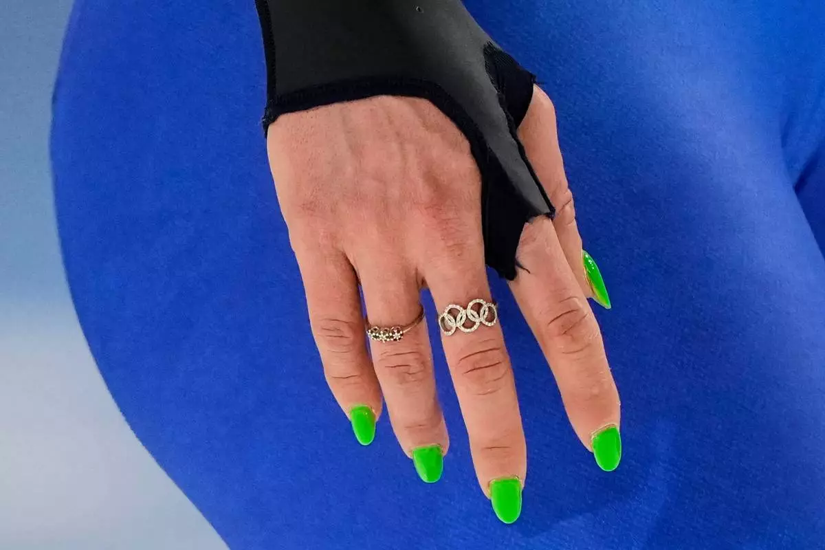 Francesca Lollobrigida of Italy wears the Olympics Rings on a ring in the women's 1500 meters speedskating race at the 2026 Winter Olympics, in Milan, Italy, Friday, Feb. 20, 2026. (AP Photo/Ben Curtis)
