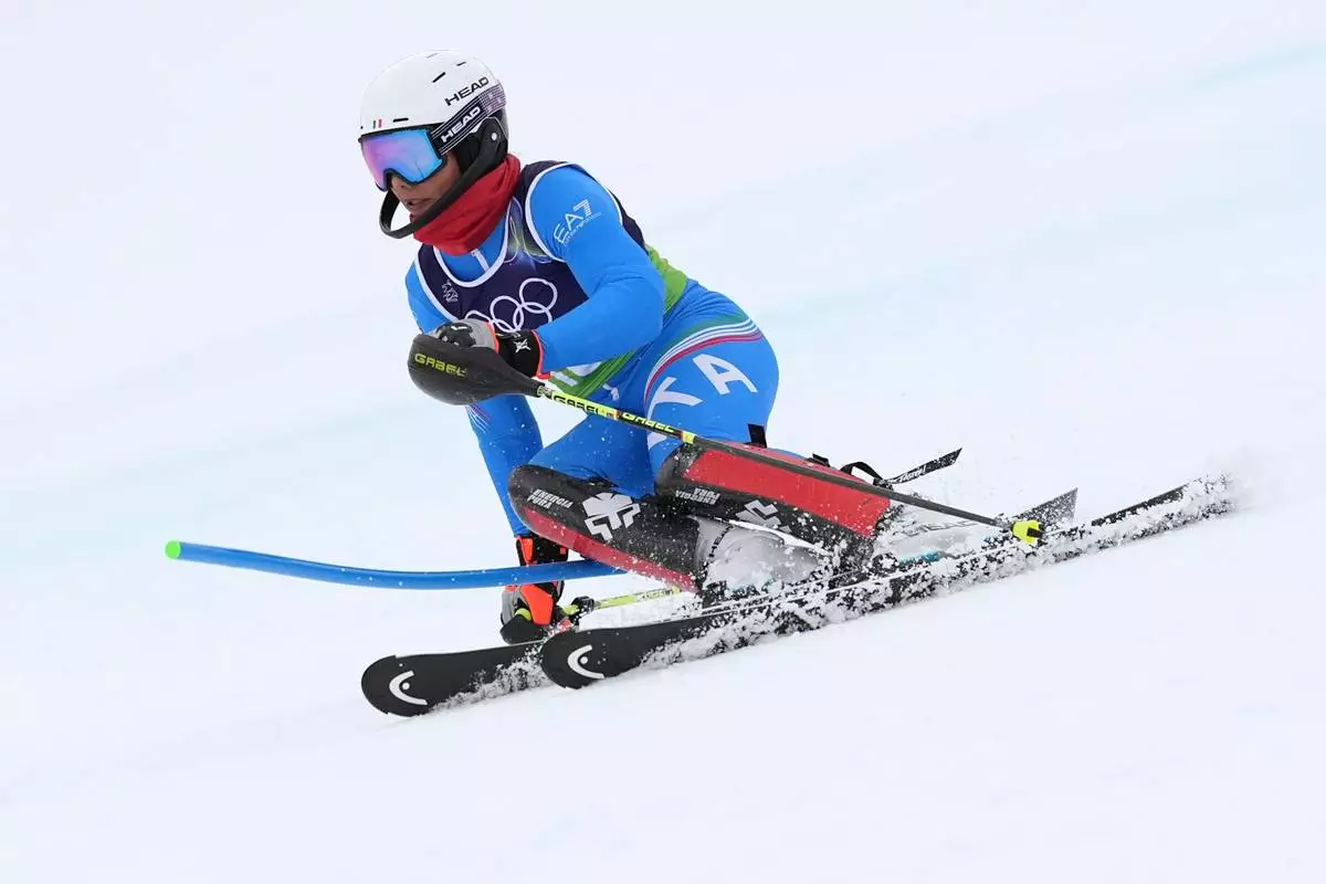 Italy's Giada d'Antonio competes in an alpine ski, women's slalom portion of a team combined race, at the 2026 Winter Olympics, in Cortina d'Ampezzo, Italy, Tuesday, Feb. 10, 2026. (AP Photo/Jacquelyn Martin)
