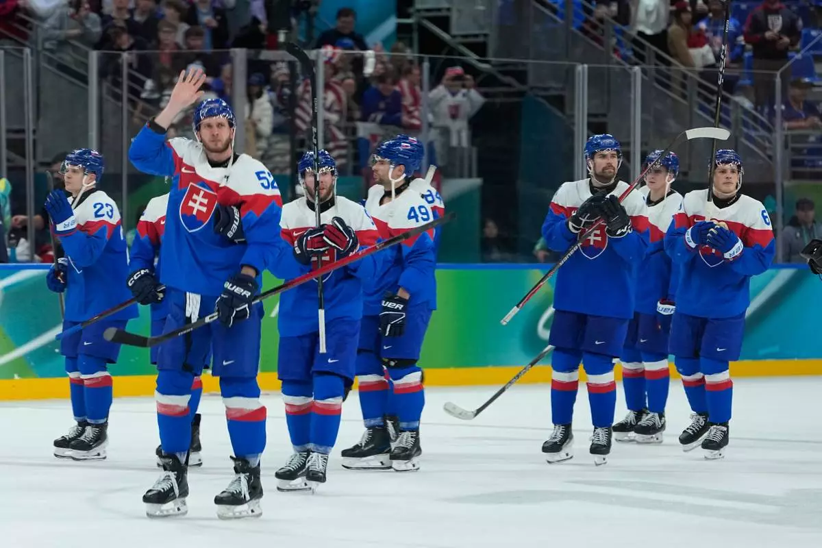 Slovakia players greet fans at the end of a men's ice hockey semifinal game between United States and Slovakia at the 2026 Winter Olympics, in Milan, Italy, Friday, Feb. 20, 2026. (AP Photo/Petr David Josek)