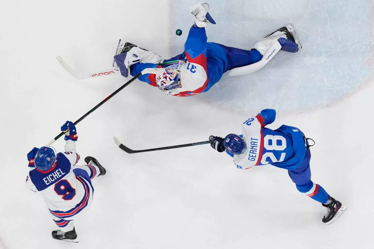 United States' Jack Eichel (9) scores his side's fourth goal during a men's ice hockey semifinal game between the United States and Slovakia at the 2026 Winter Olympics, in Milan, Italy, Friday, Feb. 20, 2026. (AP Photo/Petr David Josek)