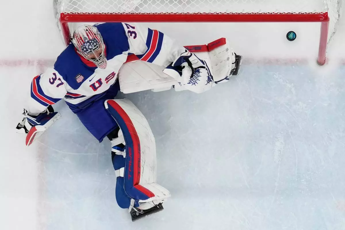 United States' Connor Hellebuyck (37) reacts after Slovakia's Juraj Slafkovsky (20) scored his side's opening goal during a men's ice hockey semifinal game between the United States and Slovakia at the 2026 Winter Olympics, in Milan, Italy, Friday, Feb. 20, 2026. (AP Photo/Petr David Josek)