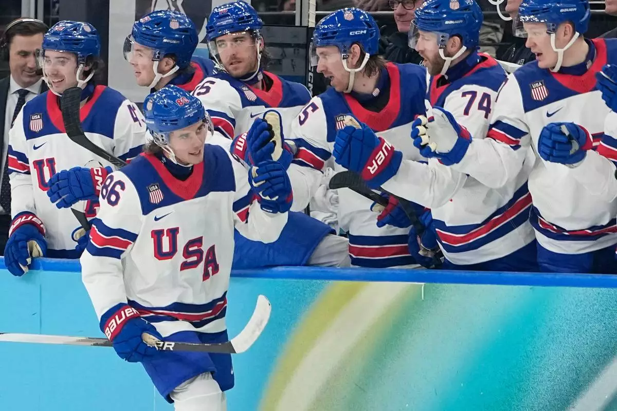 United States' Jack Hughes (86) celebrates after scoring his side's third goal during a men's ice hockey semifinal game between the United States and Slovakia at the 2026 Winter Olympics, in Milan, Italy, Friday, Feb. 20, 2026. (AP Photo/Hassan Ammar)