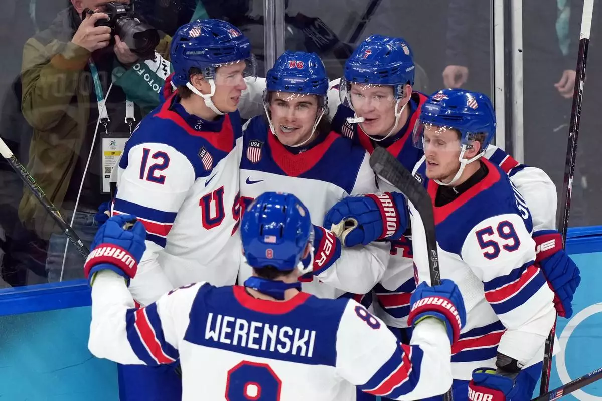 United States' Jack Hughes (86) celebrates after scoring his second goal of the game against Slovakia during the second period of a men's ice hockey semifinal game at the 2026 Winter Olympics in Milan, Italy, Friday, Feb. 20, 2026. (AP Photo/Carolyn Kaster)