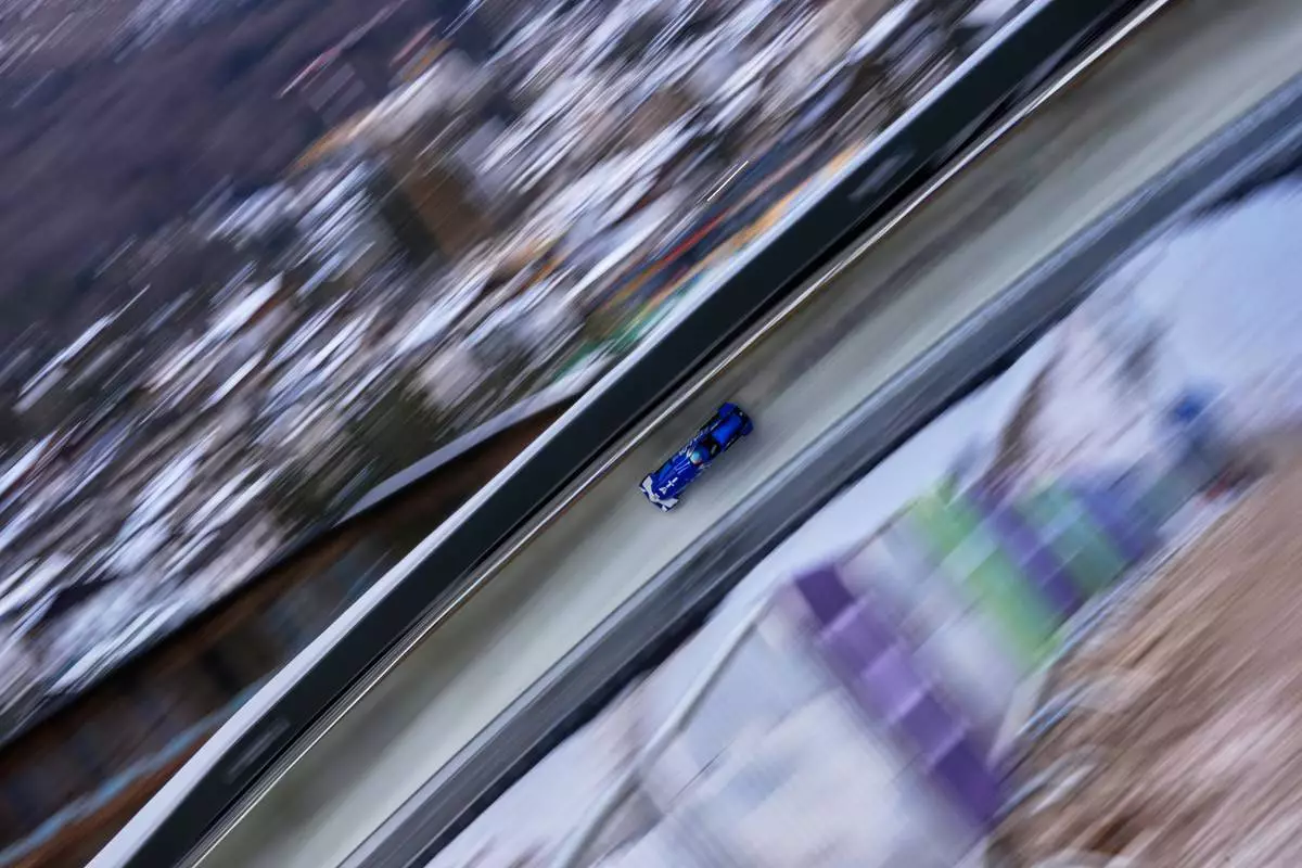 Italy's Simona de Silvestro slides down the track during a two women bobsled training session at the 2026 Winter Olympics, in Cortina d'Ampezzo, Italy, Tuesday, Feb. 17, 2026. (AP Photo/Alessandra Tarantino)