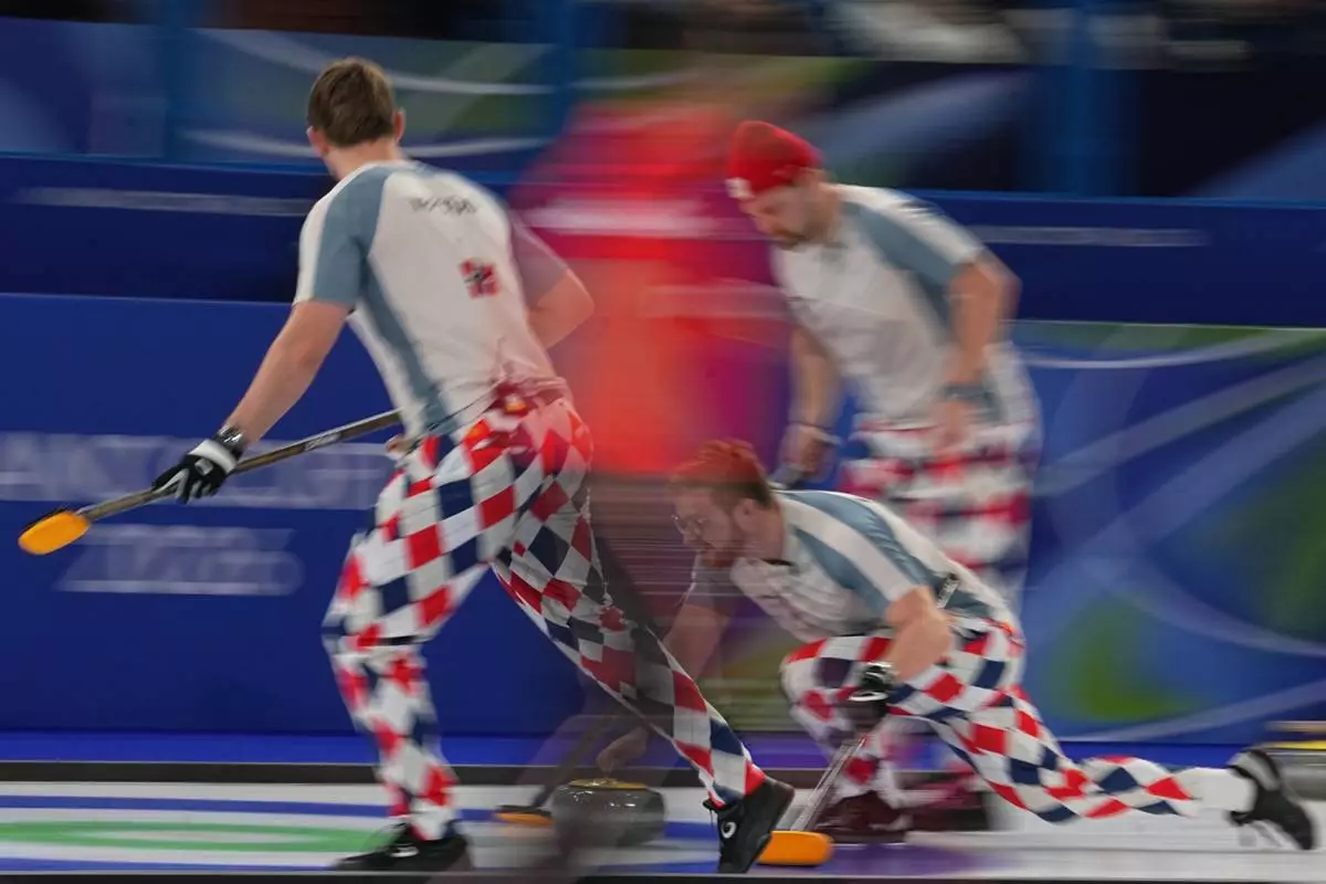 Norway's Martin Sesaker, Bendik Ramsfjell, Gaute Nepstad in action during the men's curling round robin session against Sweden at the 2026 Winter Olympics, in Cortina d'Ampezzo, Italy, Tuesday, Feb. 17, 2026. (AP Photo/Fatima Shbair)
