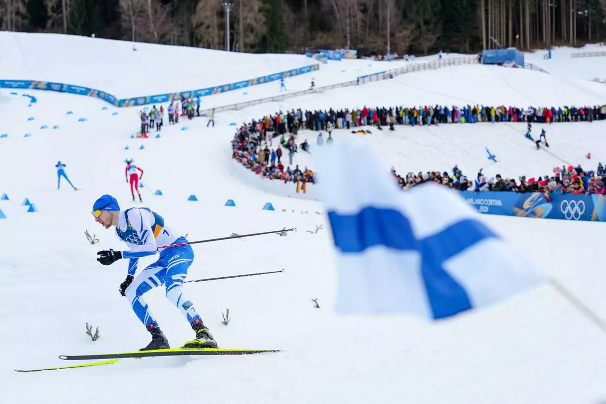 Ilkka Herola, of Finland, competes in the nordic combined individual Gundersen large hill/10km at the 2026 Winter Olympics, in Tesero, Italy, Tuesday, Feb. 17, 2026. (AP Photo/Evgeniy Maloletka)