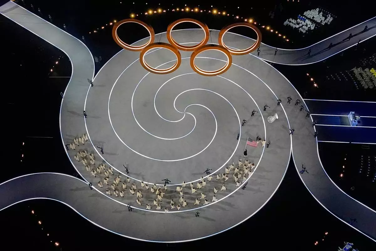 Team United States enters the stadium during the Olympic opening ceremony at the 2026 Winter Olympics, in Milan, Italy, Friday, Feb. 6, 2026. (AP Photo/David J. Phillip)