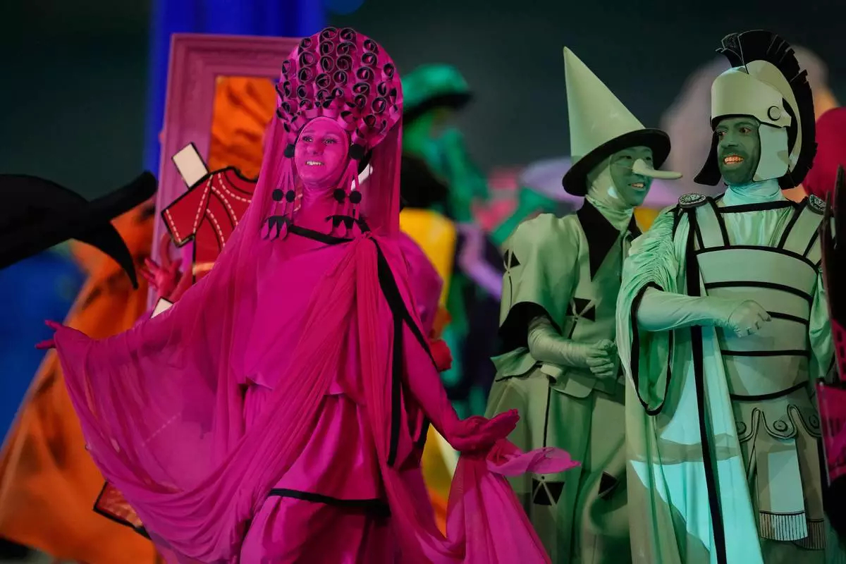 Dancers perform during the Olympic opening ceremony at the 2026 Winter Olympics, in Milan, Italy, Friday, Feb. 6, 2026. (AP Photo/Ashley Landis)