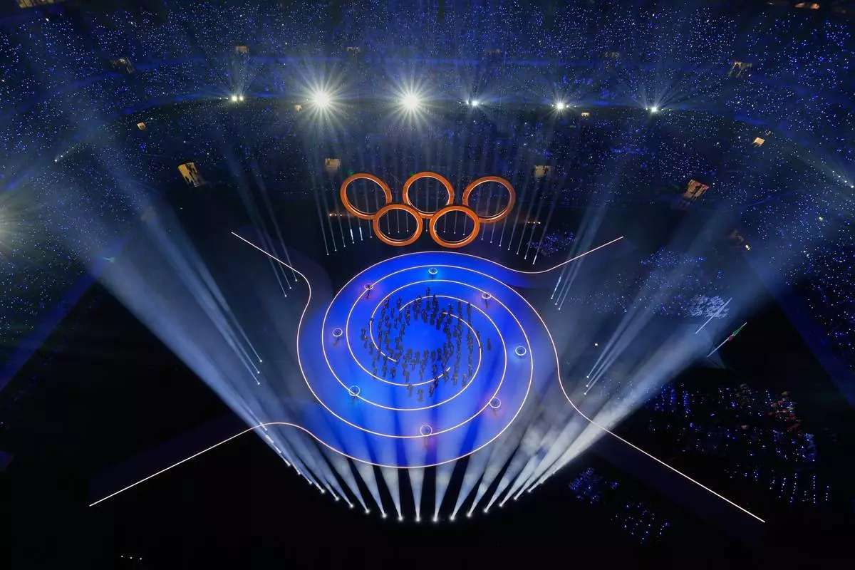 Entertainers perform during the Olympic opening ceremony at the 2026 Winter Olympics, in Milan, Italy, Friday, Feb. 6, 2026. (AP Photo/David J. Phillip)