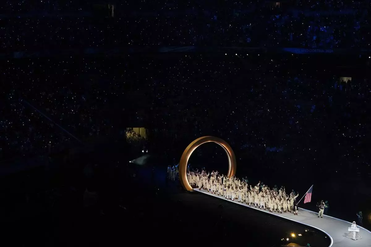 Athletes from the United States walk during the Olympic opening ceremony at the 2026 Winter Olympics, in Milan, Italy, Friday, Feb. 6, 2026. (AP Photo/Francisco Seco)