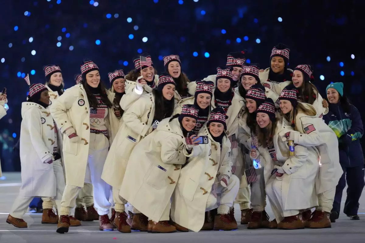 Team USA takes a group photo during the Olympic opening ceremony at the 2026 Winter Olympics, in Milan, Italy, Friday, Feb. 6, 2026. (AP Photo/Natacha Pisarenko)
