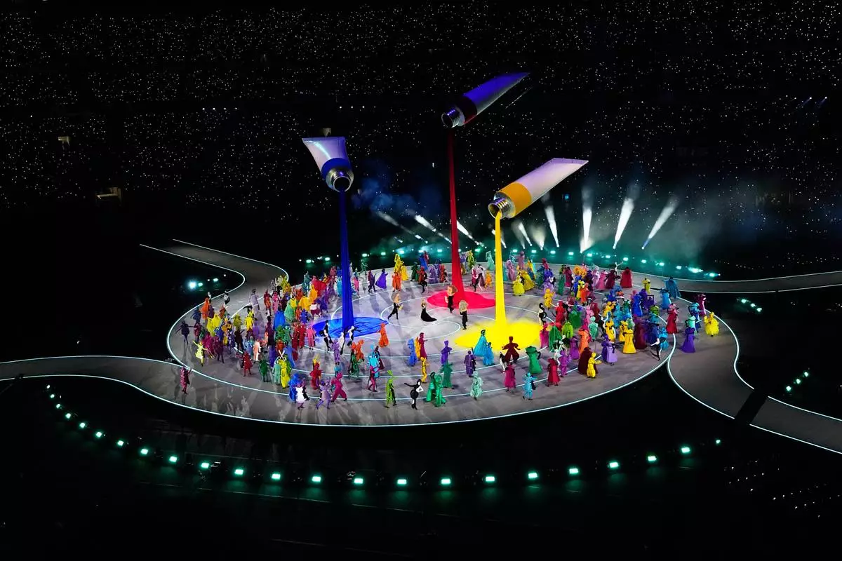 Artists perform during the Olympic opening ceremony at the 2026 Winter Olympics, in Milan, Italy, Friday, Feb. 6, 2026. (AP Photo/Petr David Josek)