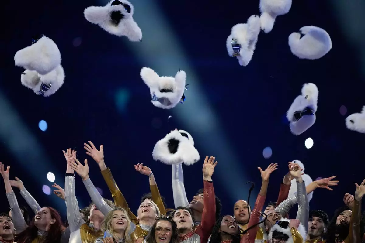 Dancers perform during the Olympic opening ceremony at the 2026 Winter Olympics, in Milan, Italy, Friday, Feb. 6, 2026. (AP Photo/Natacha Pisarenko)