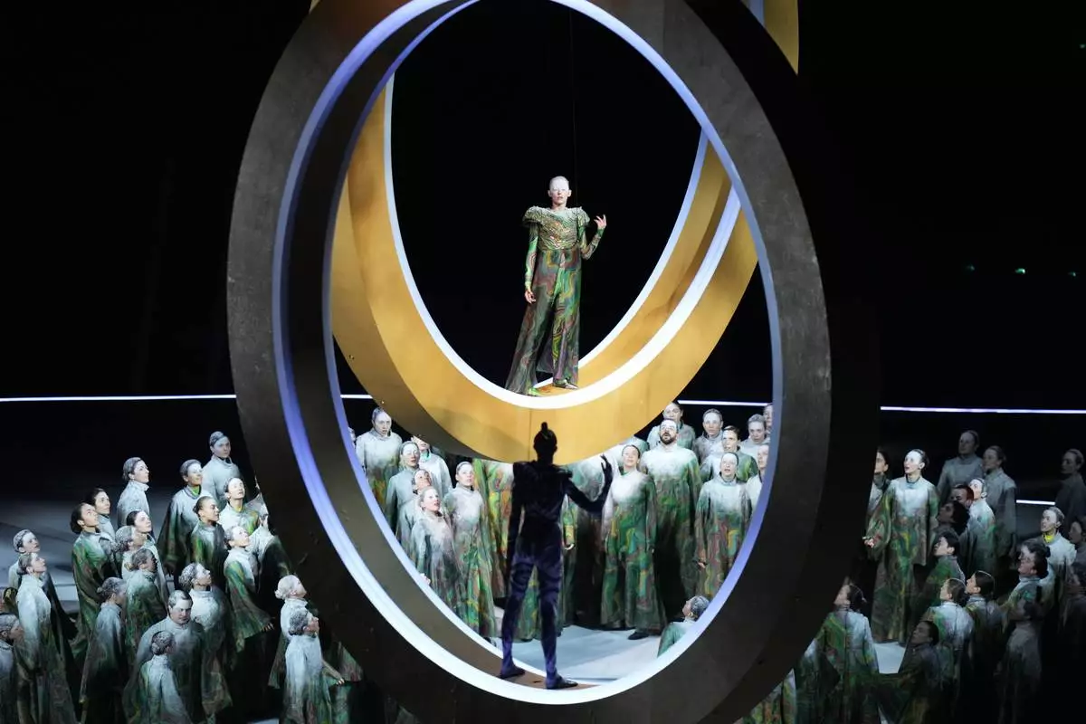 Artists perform during the Olympic opening ceremony at the 2026 Winter Olympics, in Milan, Italy, Friday, Feb. 6, 2026. (AP Photo/Stephanie Scarbrough)