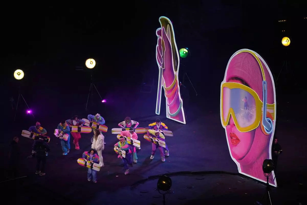 Artists perform during the Olympic opening ceremony at the 2026 Winter Olympics, in Milan, Italy, Friday, Feb. 6, 2026. (AP Photo/Ben Curtis)