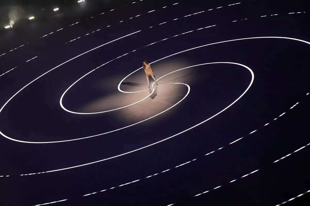 Italian actor Sabrina Impacciatore performs during the Olympic opening ceremony at the 2026 Winter Olympics, in Milan, Italy, Friday, Feb. 6, 2026. (AP Photo/Francisco Seco)