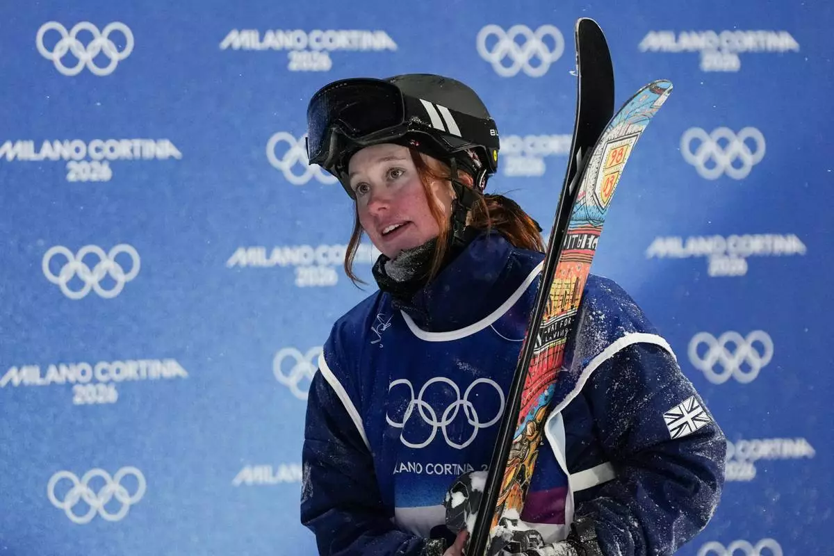 Britain's Kirsty Muir reacts after crashing during the women's freestyle skiing big air finals at the 2026 Winter Olympics, in Livigno, Italy, Monday, Feb. 16, 2026. (AP Photo/Gregory Bull)