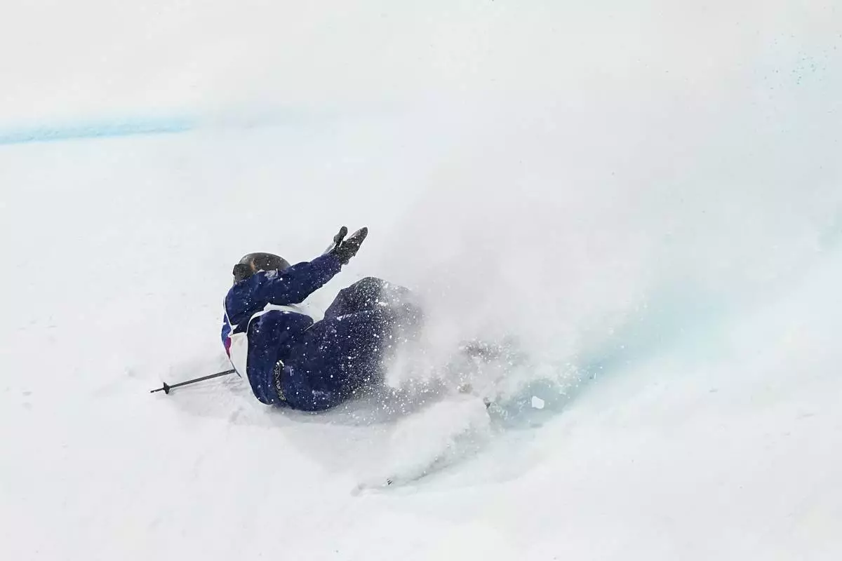 Britain's Kirsty Muir crashes during the women's freestyle skiing big air finals at the 2026 Winter Olympics, in Livigno, Italy, Monday, Feb. 16, 2026. (AP Photo/Gregory Bull)