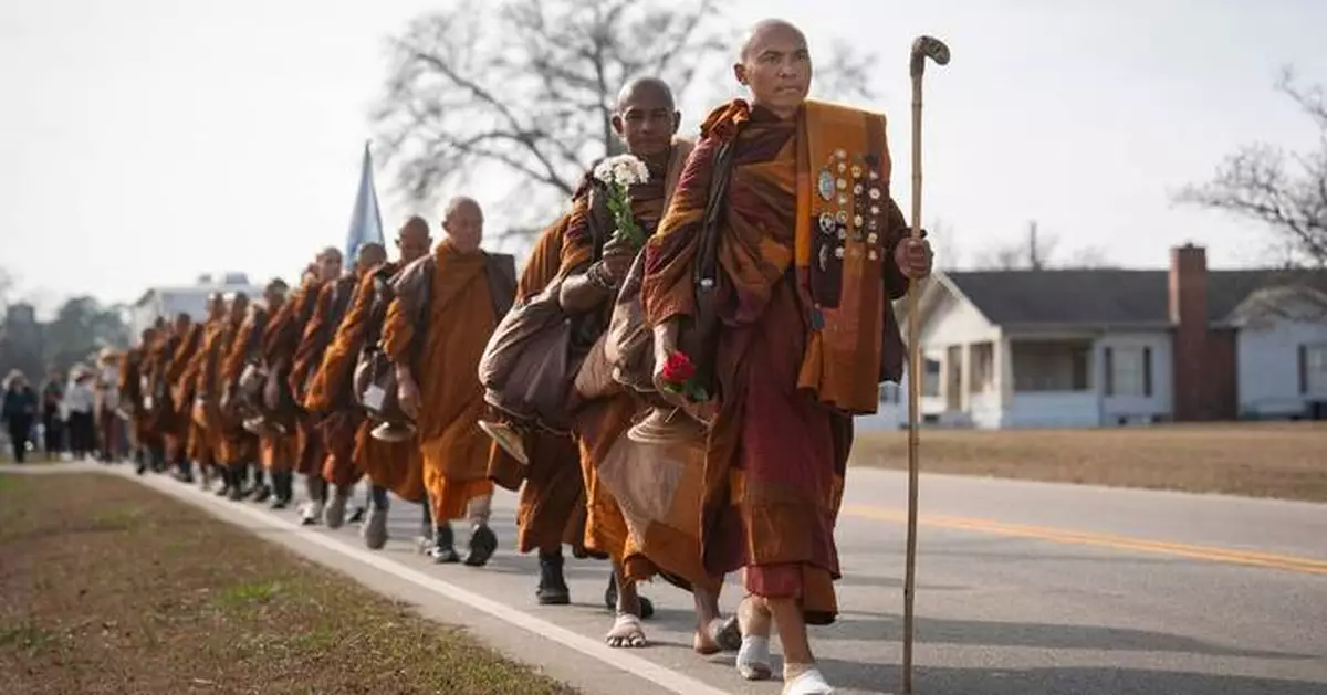 Photos of monks and rescue dog as they finish cross-country peace walk in Washington, DC