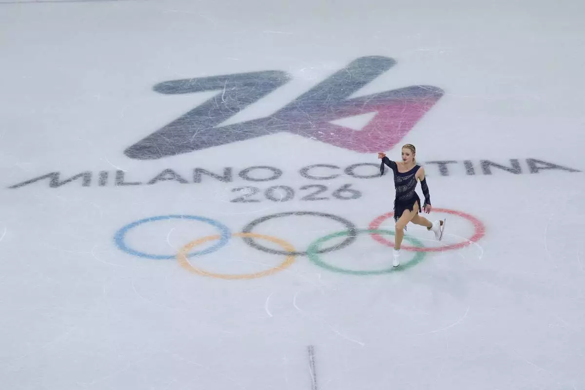 Amber Glenn of the United States competes during the figure skating women's team event at the 2026 Winter Olympics, in Milan, Italy, Sunday, Feb. 8, 2026. (AP Photo/Natacha Pisarenko)