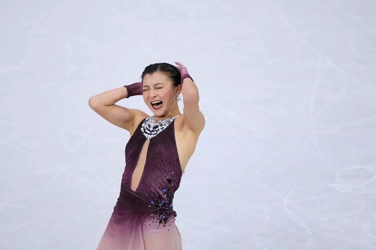 Kaori Sakamoto of Japan competes during the figure skating women's team event at the 2026 Winter Olympics, in Milan, Italy, Sunday, Feb. 8, 2026. (AP Photo/Natacha Pisarenko)