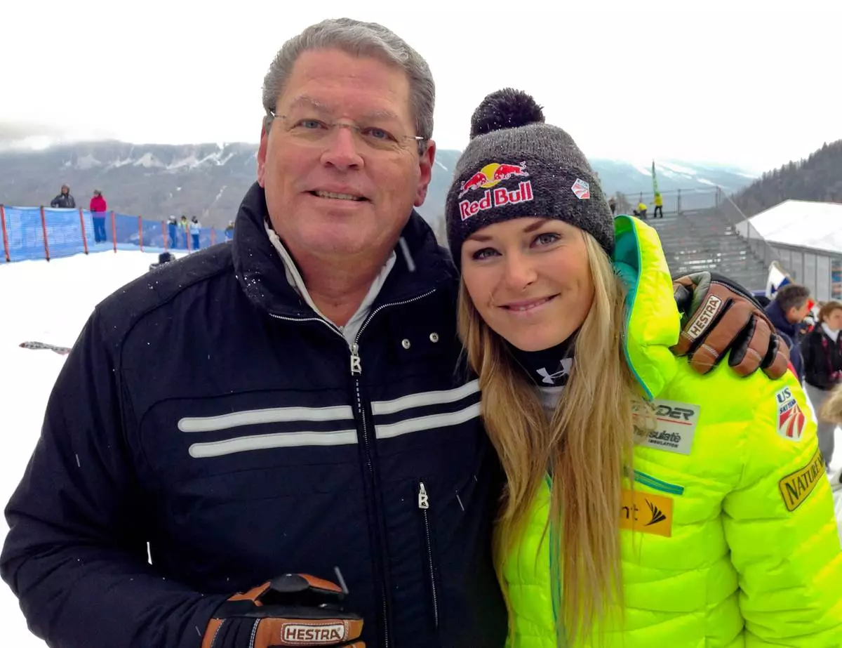 FILE - United States' Lindsey Vonn, right, poses for photographs with her father Alan Kildow at the end of an alpine ski, women's World Cup downhill race, in Cortina d'Ampezzo, Italy, Friday, Jan. 16, 2015. (AP Photo/Andrew Dampf, File)