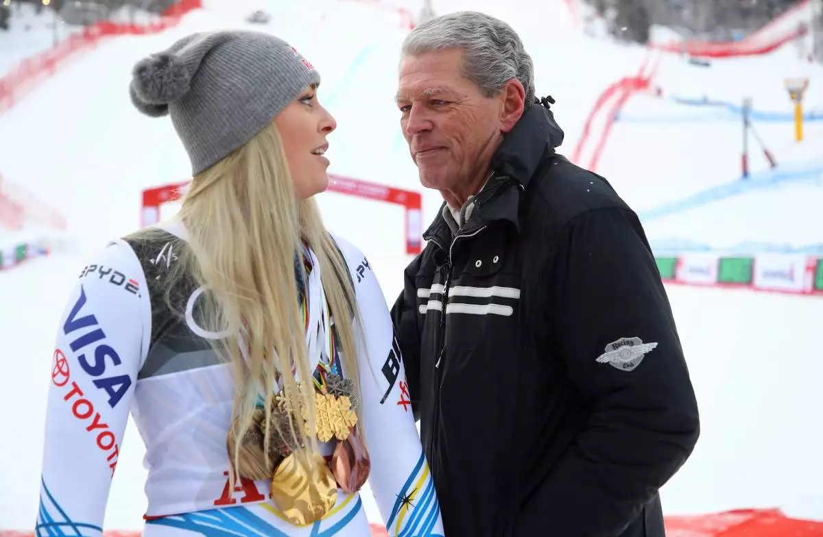 FILE - United States' Lindsey Vonn poses with her career medals with her father Alan Kildow, in the finish area after the women's downhill race, at the alpine ski World Championships in Are, Sweden, Sunday, Feb. 10, 2019. (AP Photo/Marco Trovati, File)