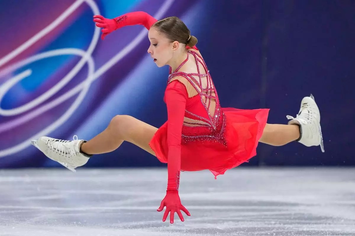 Mariia Seniuk of Israel falls during the women's figure skating free program at the 2026 Winter Olympics, in Milan, Italy, Thursday, Feb. 19, 2026. (AP Photo/Natacha Pisarenko)